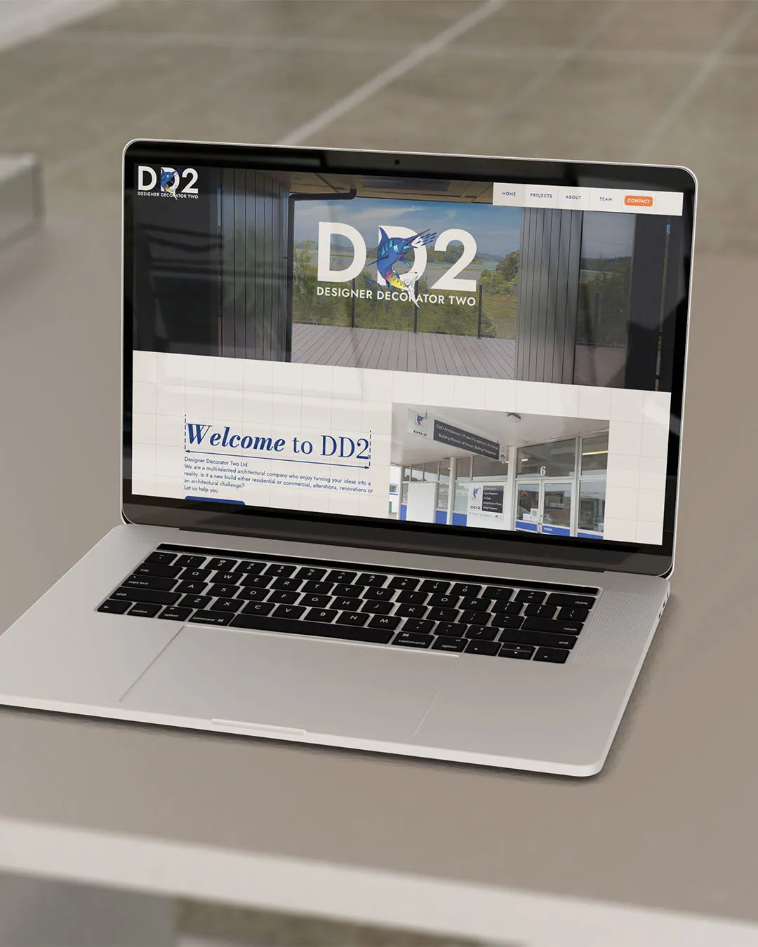 The DD2 website displayed on a MacBook pro