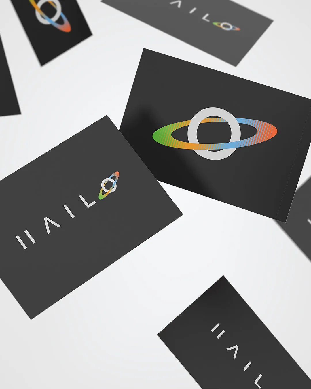 Two versons of the HAILO logo mocked up on a business card- one which has the name of the project and the other which has the icon for it.